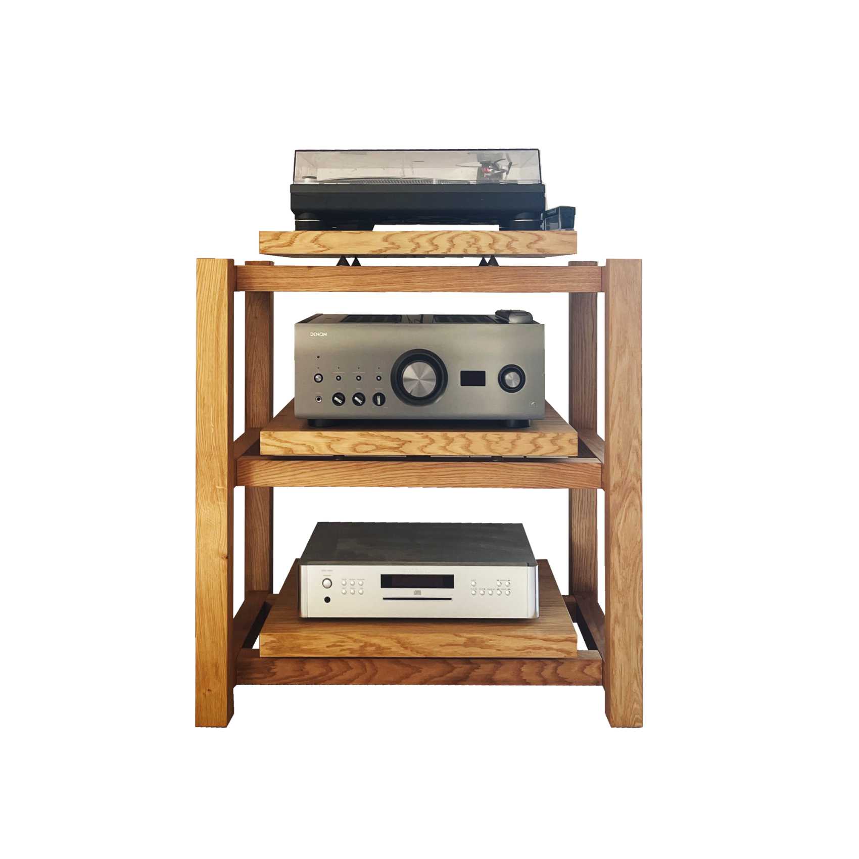 Handmade wooden audio rack for hifi amplifier and turntable on the top shelf, a Denon amplifier below, and a Rotel RCD-1572 CD player on the lowest platform, forming a minimalist audiophile setup photographed against a plain background.
