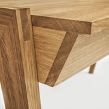 Close-up of a real wood desk with drawer with visible oak grain and joint details on a white background 